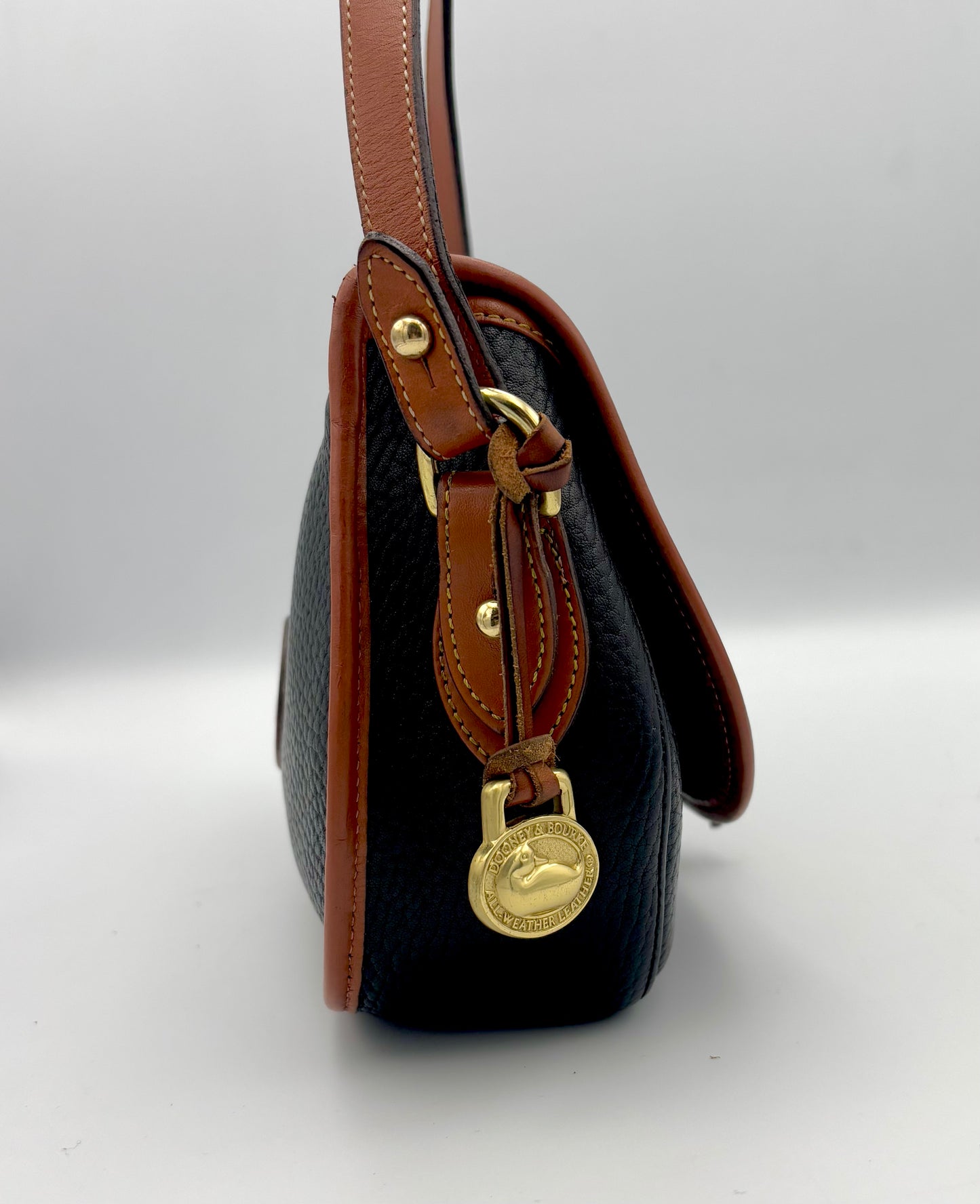 Authenticated Vintage Dooney & Bourke All Weather Leather Black/Tan Small Tack Saddlebag Crossbody